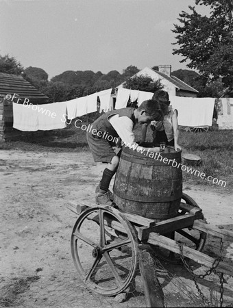 BOYS WITH WATER BARREL